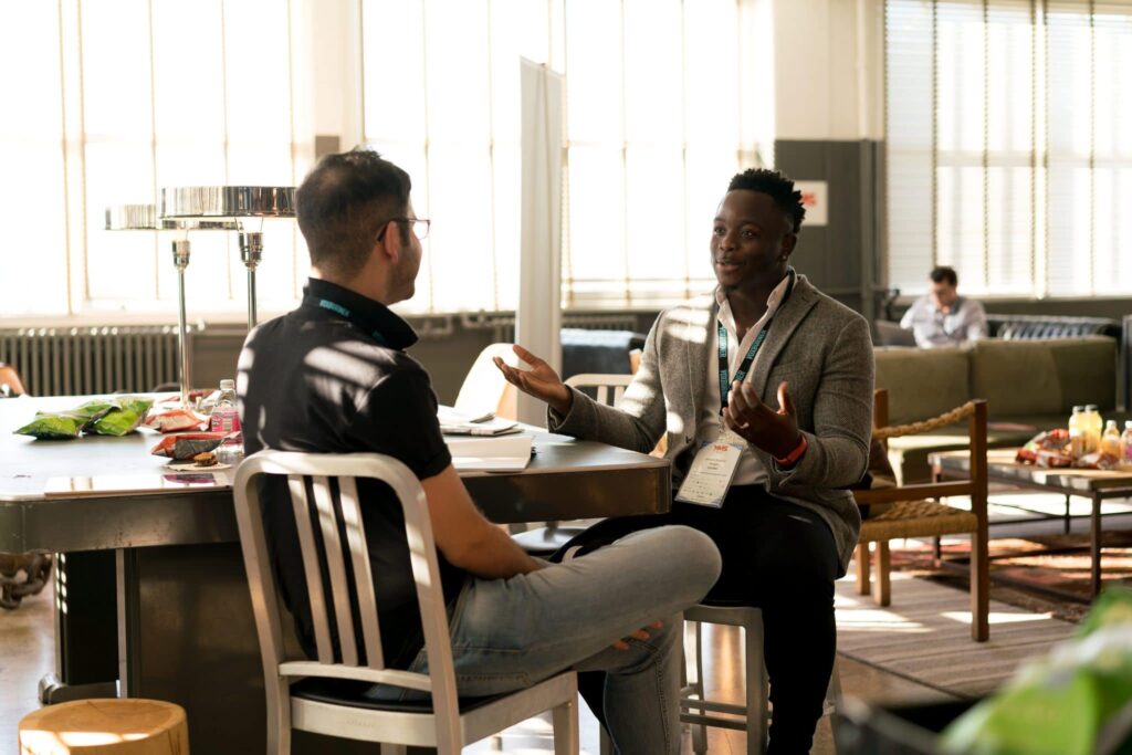 Photo of men having conversation - Photo by nappy on Pexels