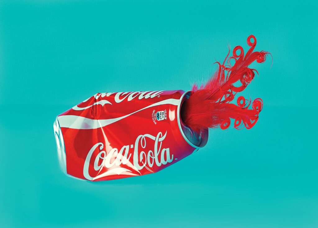 CocaXplosion Coca Cola Can Crushed - Photo by Monica Silva on Unsplash