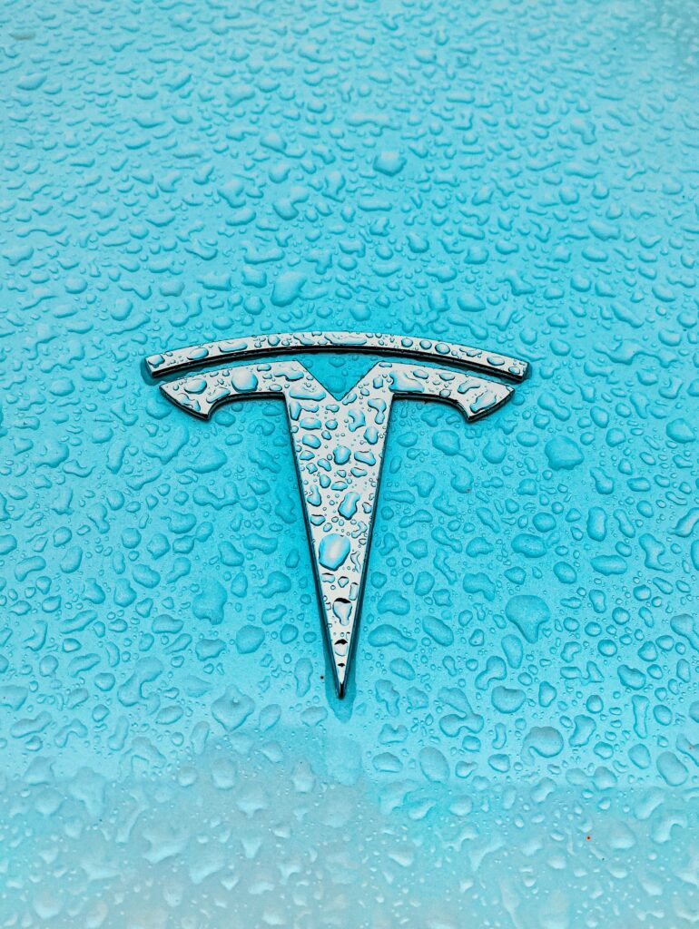 silver colored letter k wall decor - Tesla Logo - Photo by Priscilla Du Preez on Unsplash